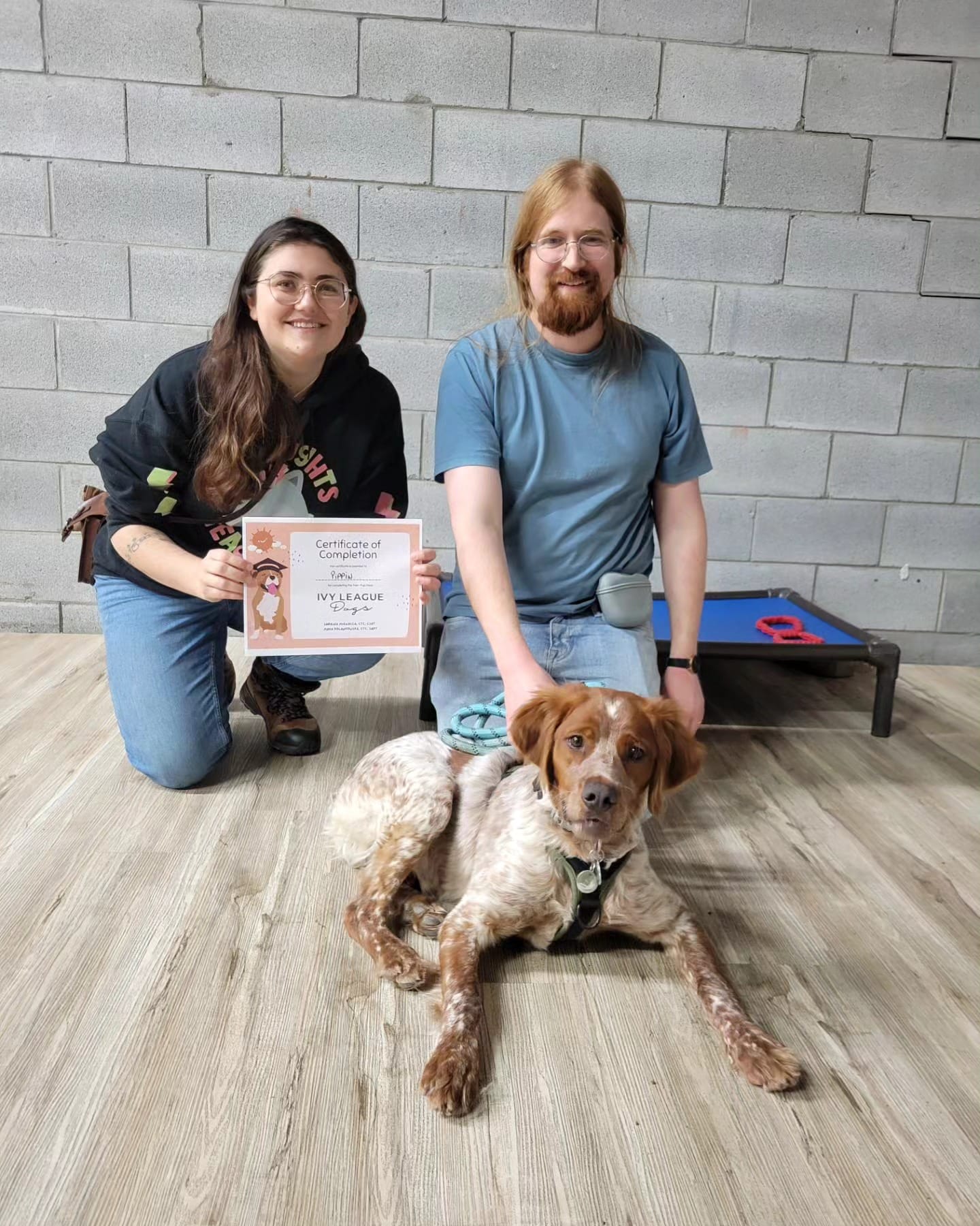 Leif, Gersande, and Pippin posing with Pip's little graduation certificate.