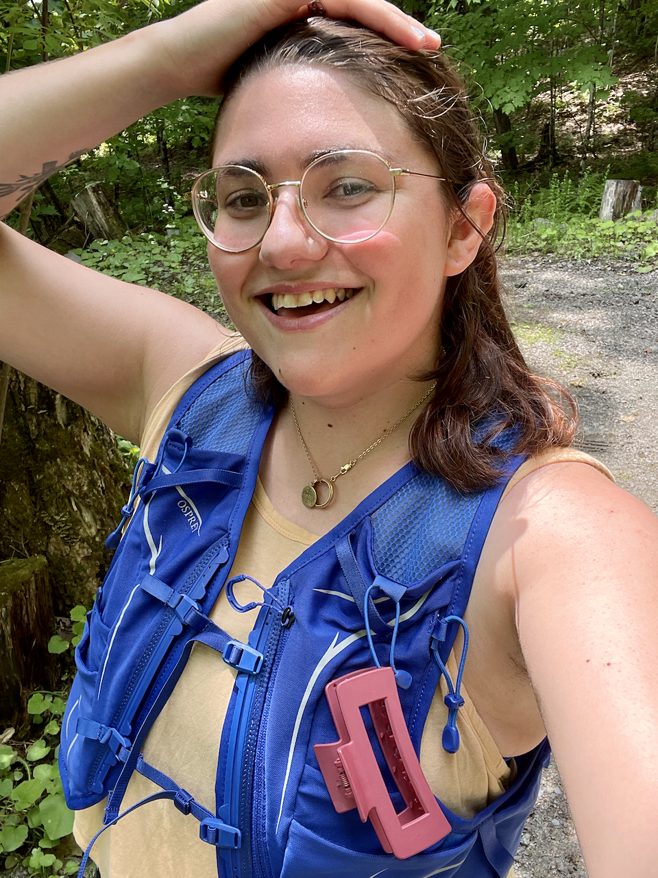 A photo of Gersande after a run smiling into the camera.